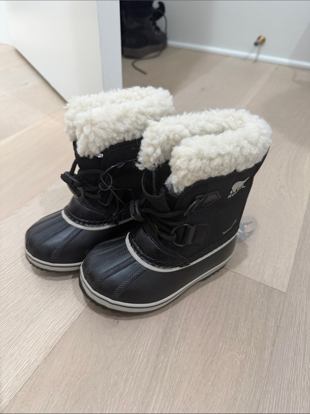 Sorel Black Kids Snow Boots with Cream Shearling Cuff